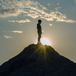 Character Transformation: silhouette of a boy on a mountaintop