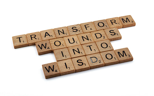 Scrabble tiles Transform Wounds Into Wisdom